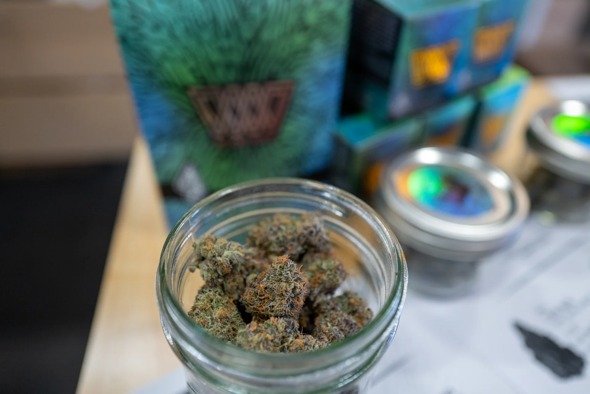 A customer completing a purchase at a cannabis brand booth using Meadow point of sale at Hall of Flowers