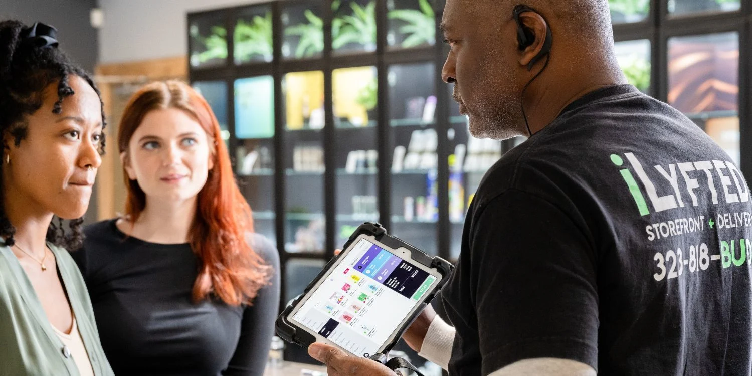 Budtender Assisting Customers at ILYFTED Dispensary