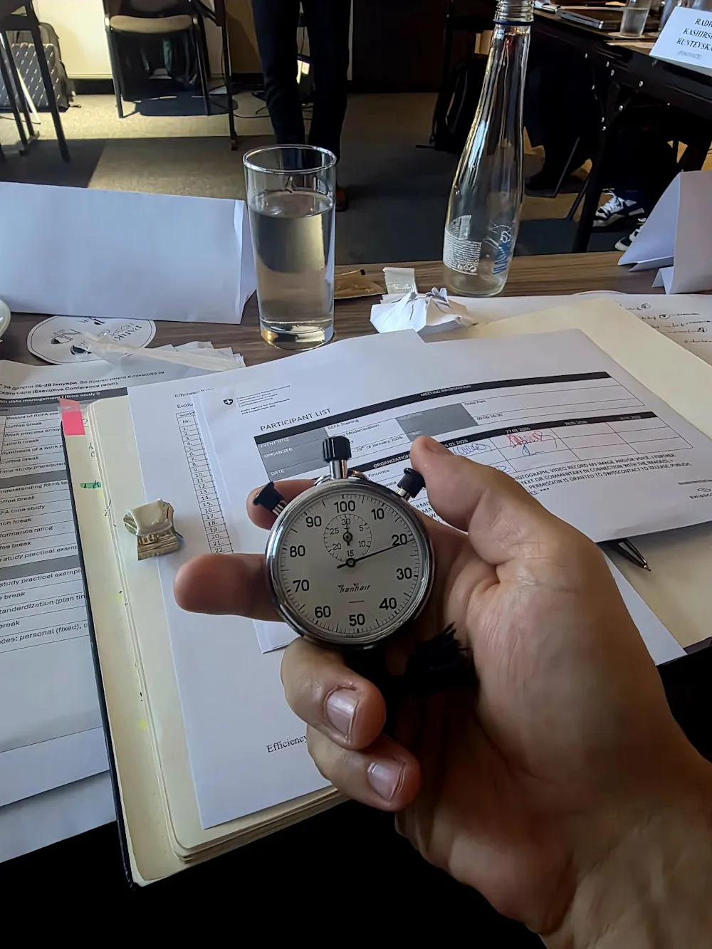 A stopwatch and time-study worksheet during REFA work-measurement training