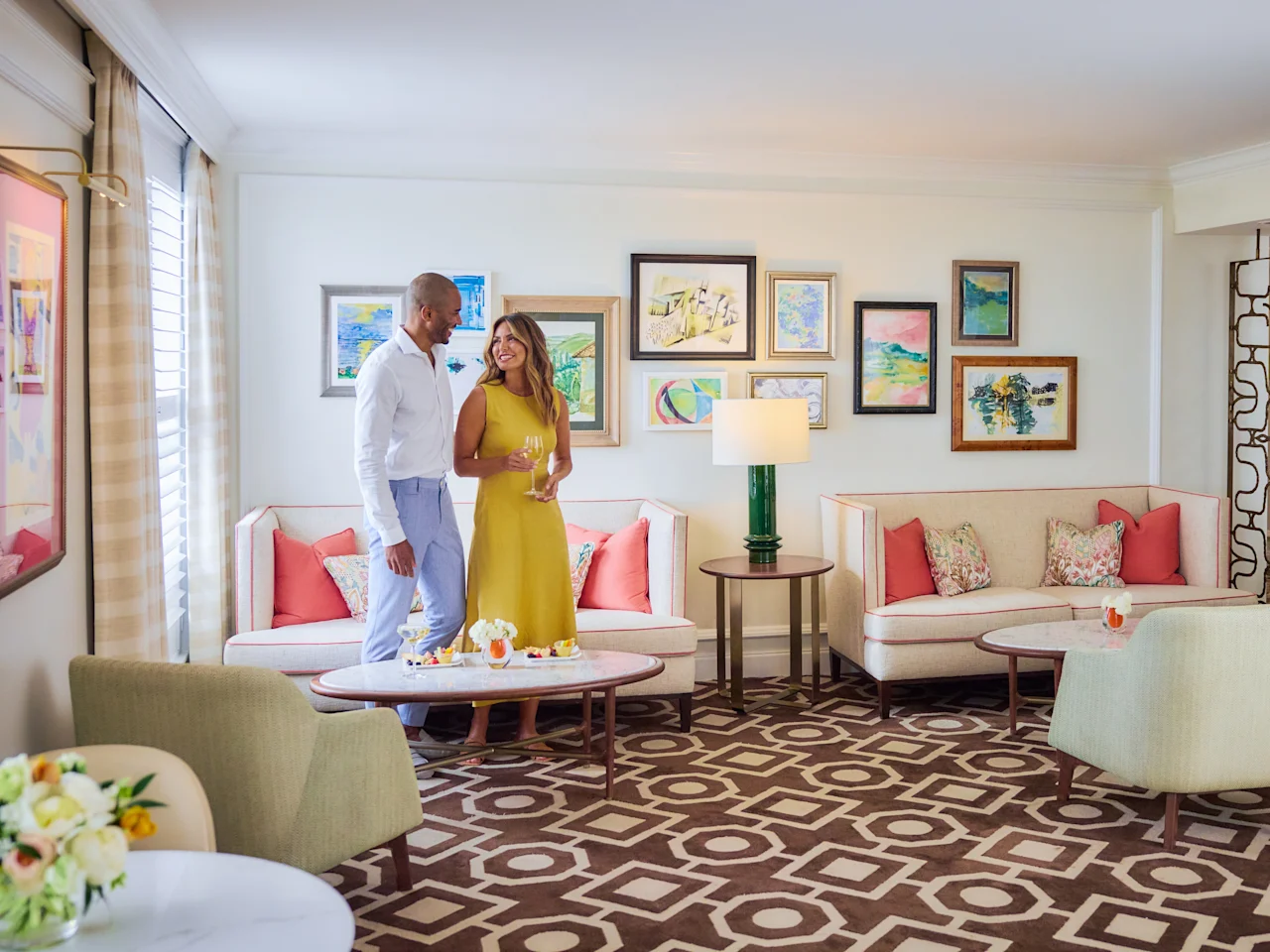 A couple enjoys cocktails in Flagler Club's private lounge