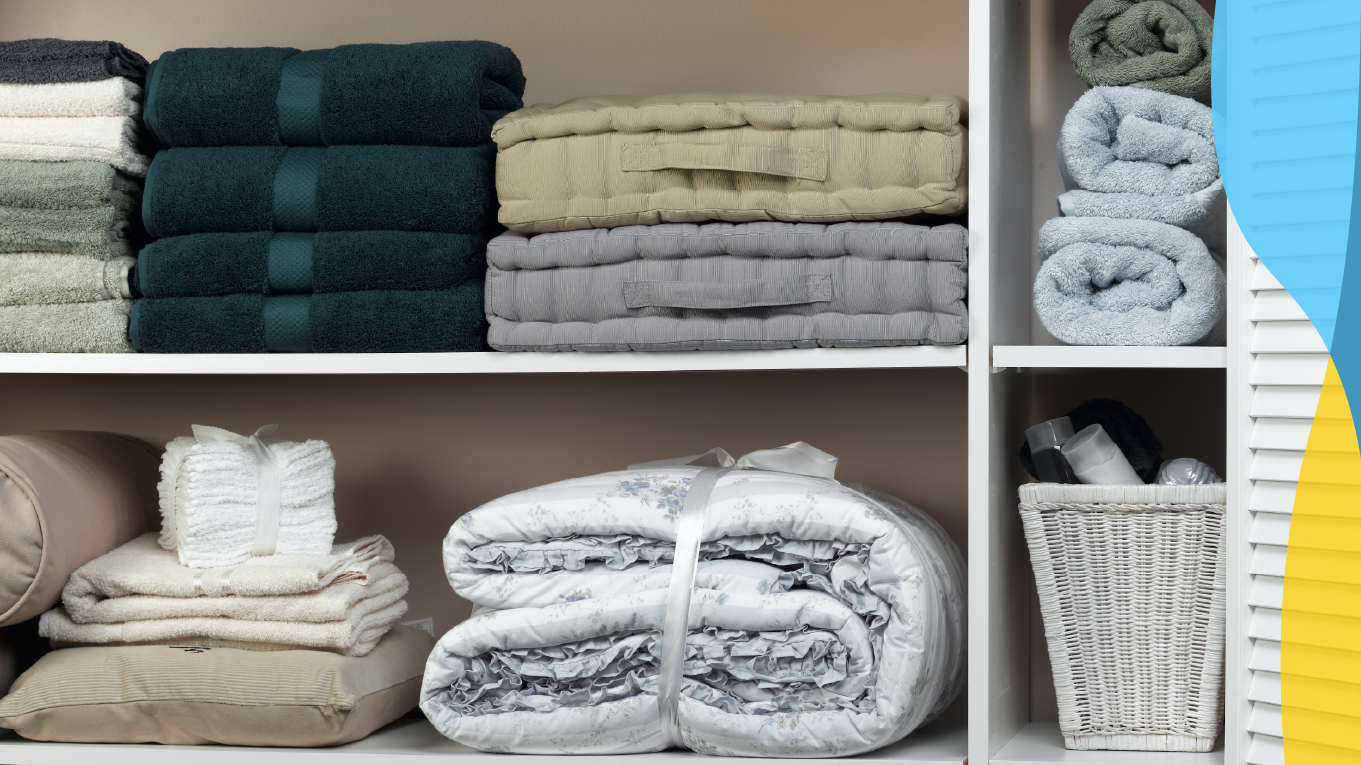 Closet is organized with folded towels, floor cushions, pillows, and extra blankets.