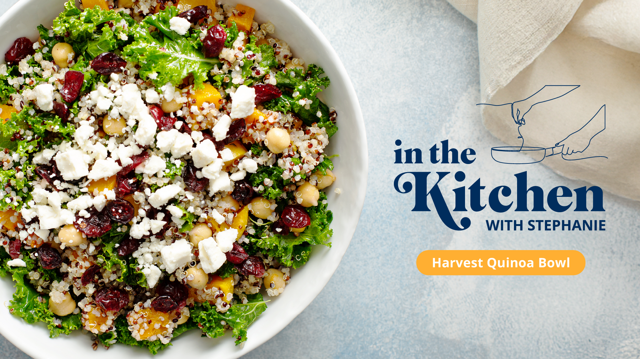 A white bowl filled with quinoa, kale, cranberries, apples, and feta.