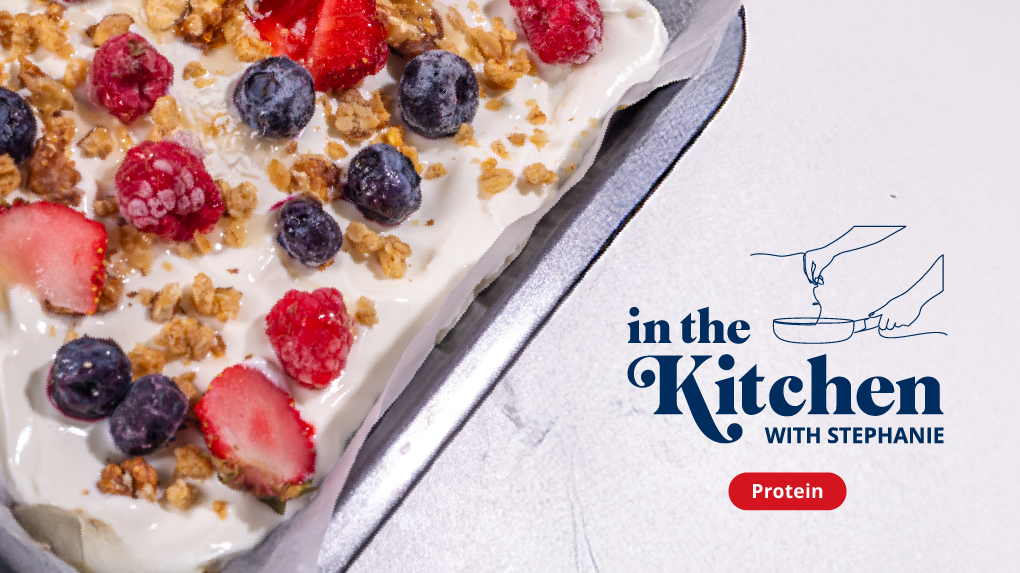 Sheet pan with frozen yogurt, granola, and berries