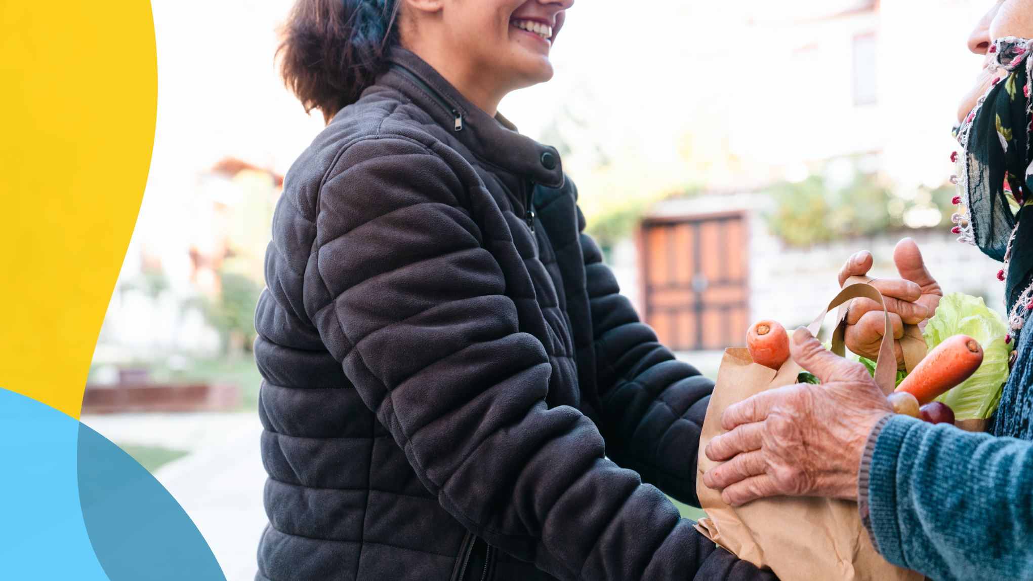 Woman in a black jacket bringing a mature woman groceries.