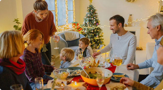 extended family gathering at dinner table for christmas