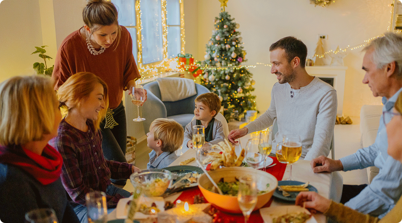 extended family gathering at dinner table for christmas