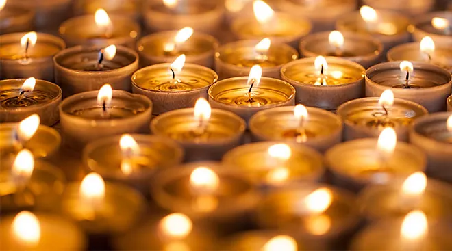 lit candles as tribute to lives lost