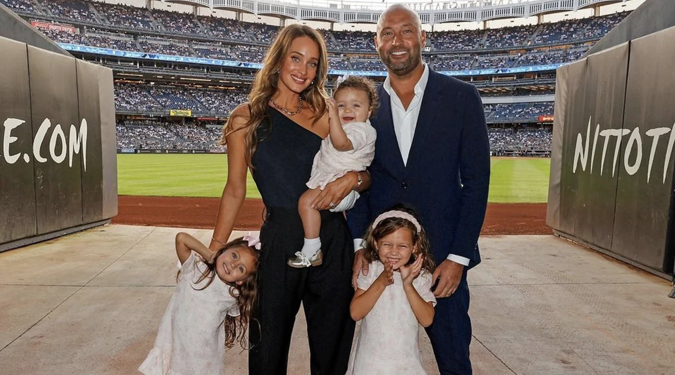 derek and hannah jeter posing with family at yankee stadium