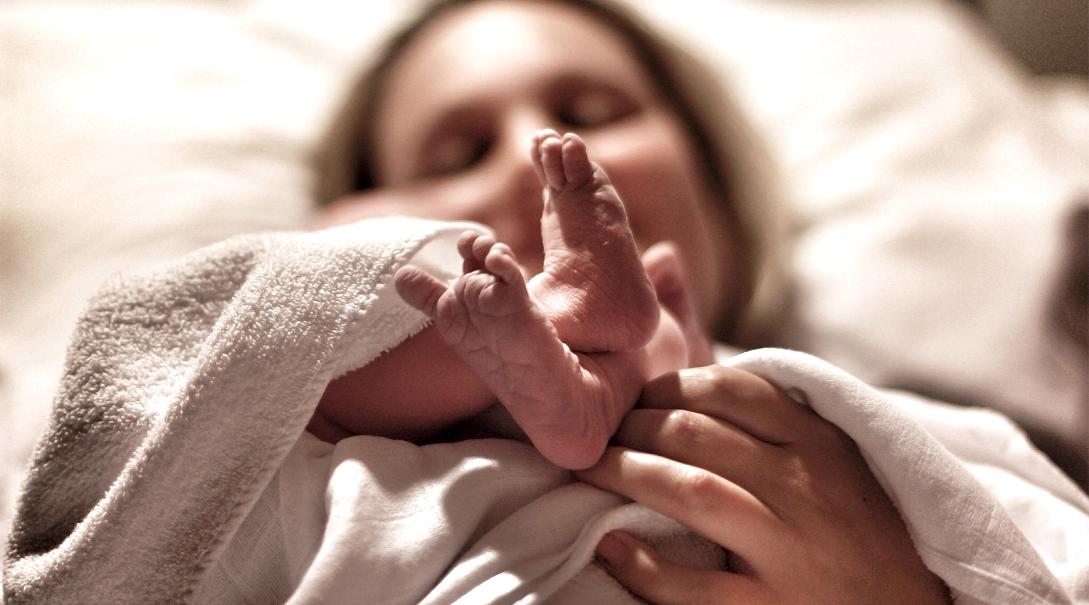 woman who just gave birth laying down at the hospital