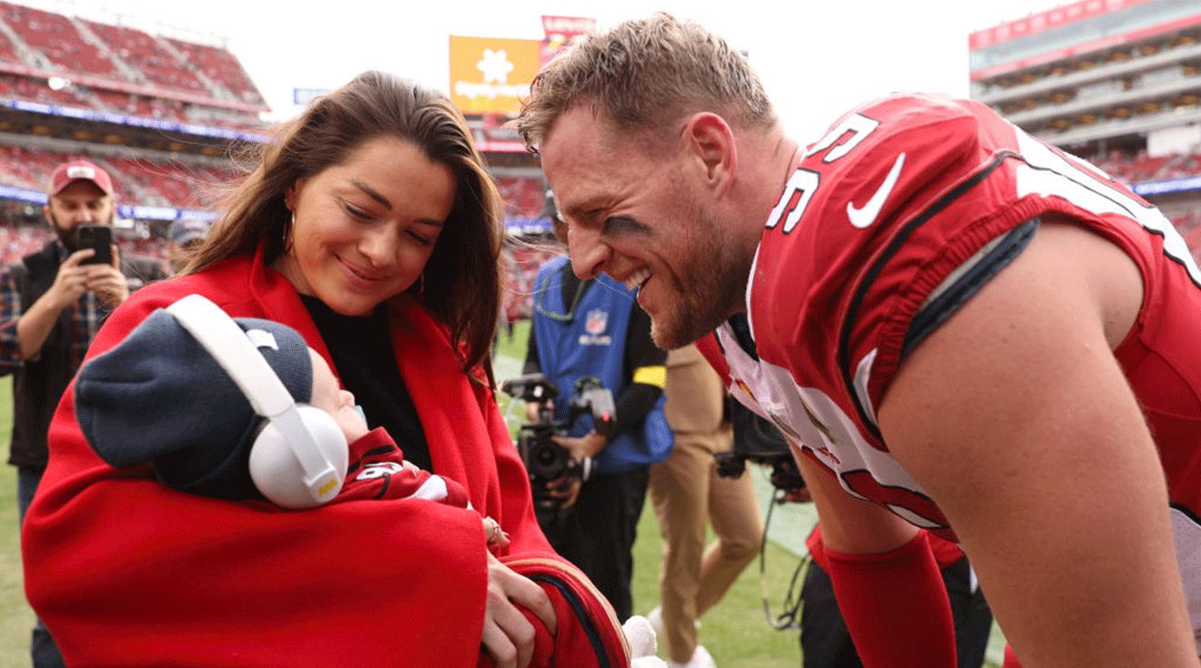 J.J. Watt #99 of the Arizona Cardinals talks with his wife Kealia Watt and son Koa Watt prior to the game against the San Francisco 49ers at Levi's Stadium on January 08, 2023 in Santa Clara, California