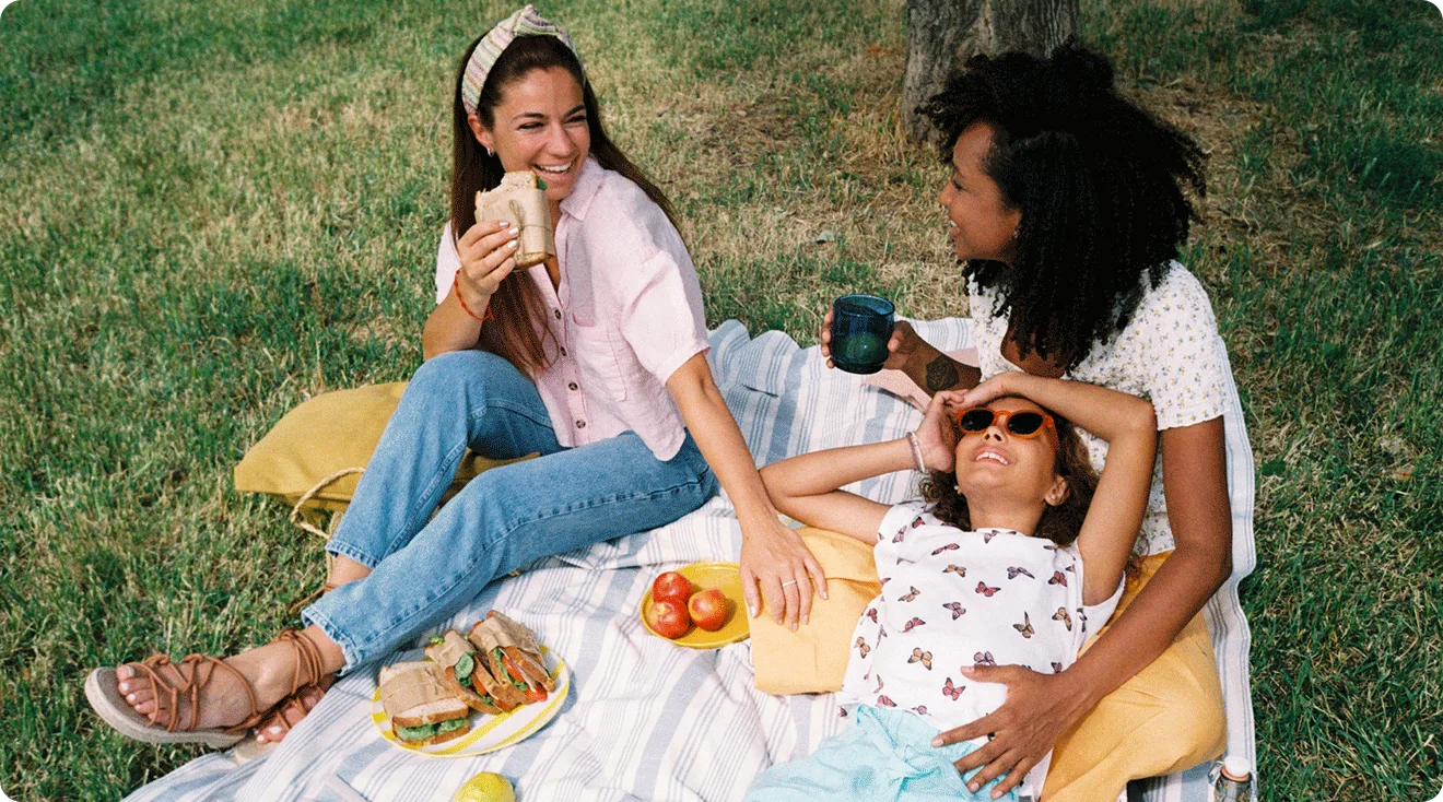 LGBTQ family having a picnic in the park