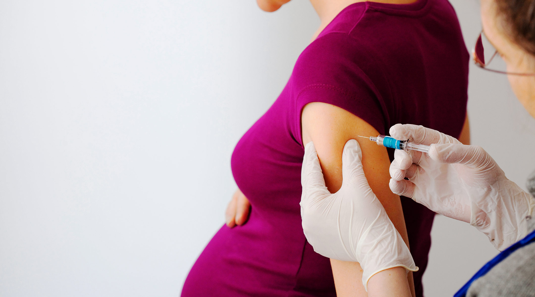 pregnant woman getting flu shot