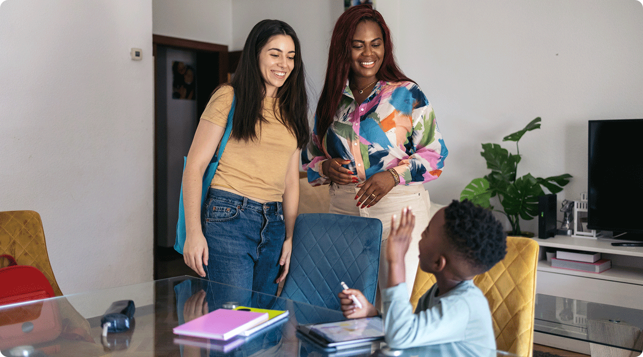 mom introducing babysitter to her son at home