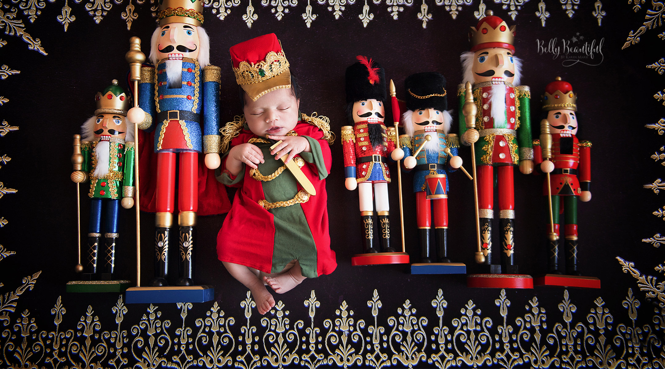 newborn baby dressed as the nutcracker prince, surrounded by actual wooden nutcrackers