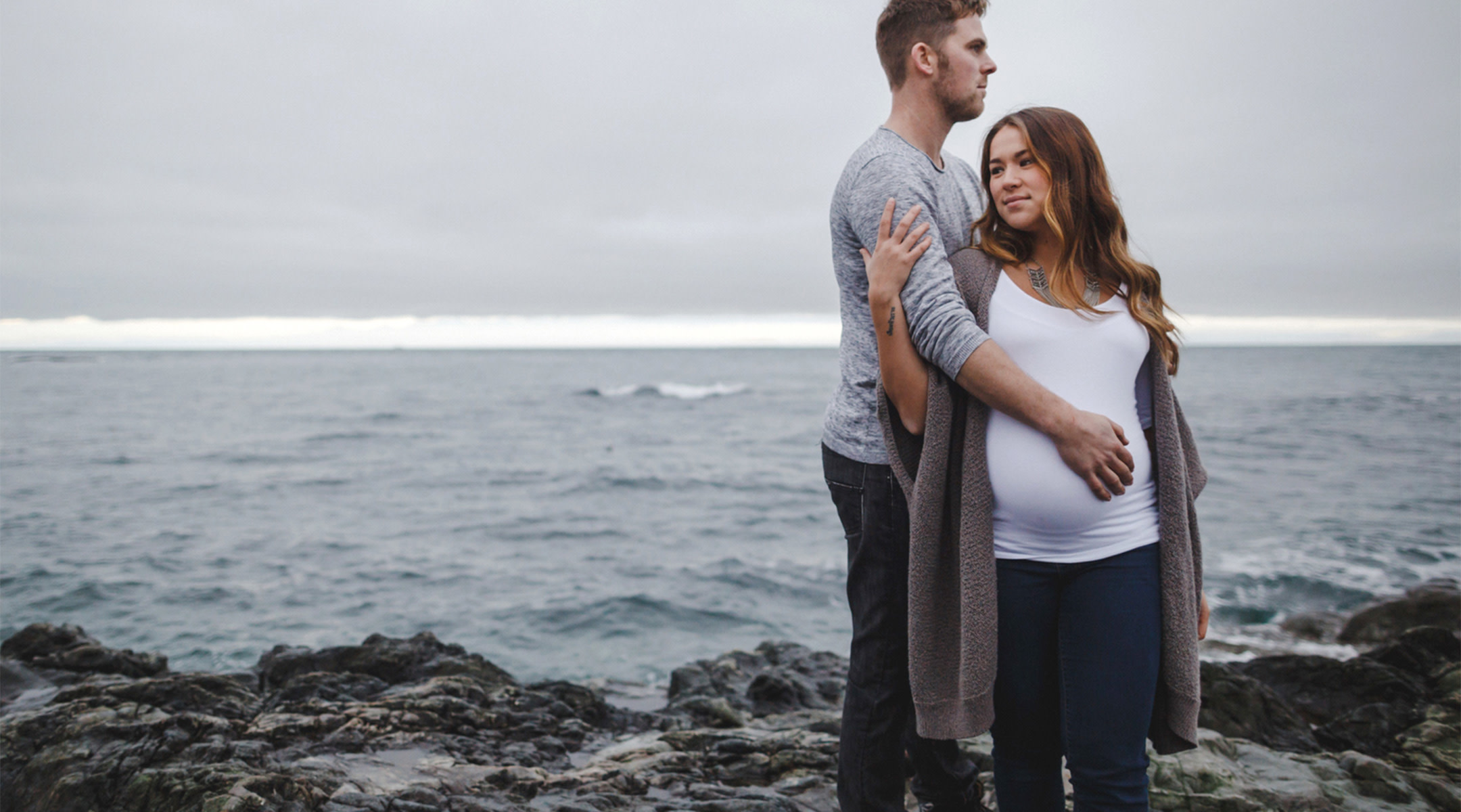 Pregnant belly. Husband and wife getting ready in the morning photo.