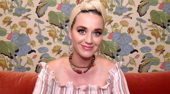 celebrity katy perry at home in front of floral wall paper
