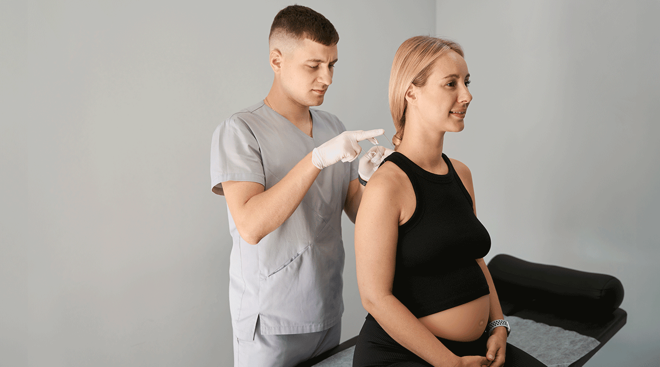 pregnant woman getting acupuncture on neck