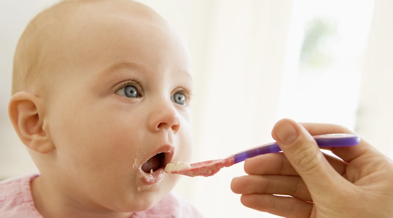 baby being fed baby food