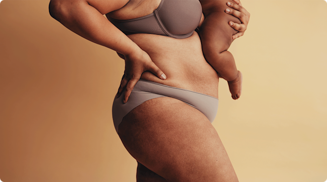 close up of postpartum mother holding baby