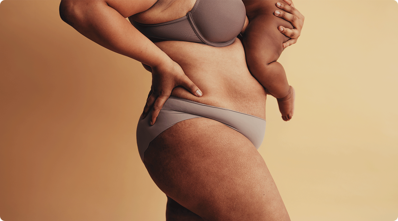 close up of postpartum mother holding baby