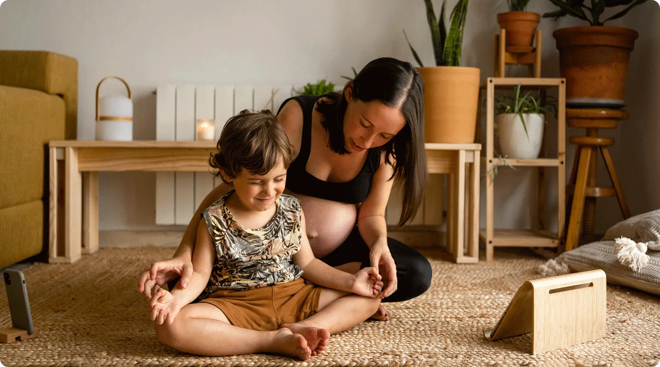 mom and toddler doing yoga at home