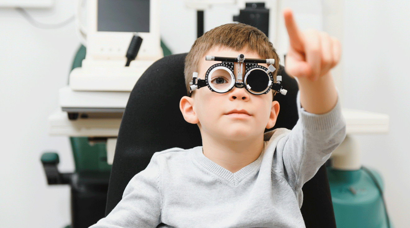 child having an eye exam at pediatric ophthalmologist 