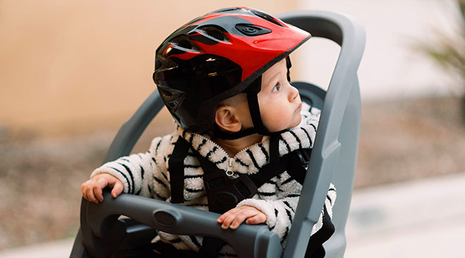 Baby in a bike seat.