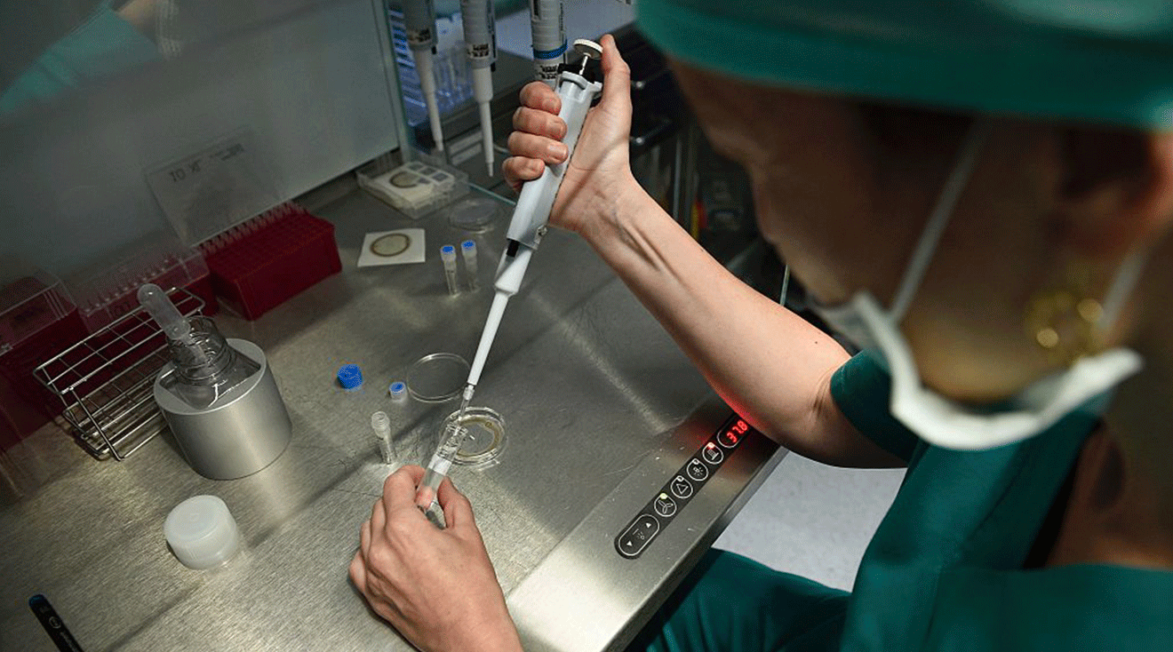 An employee at the clinic Eugin prepares a sample of sperm and an egg for the process of fertilization under the microscope on May 25, 2016 in Barcelona