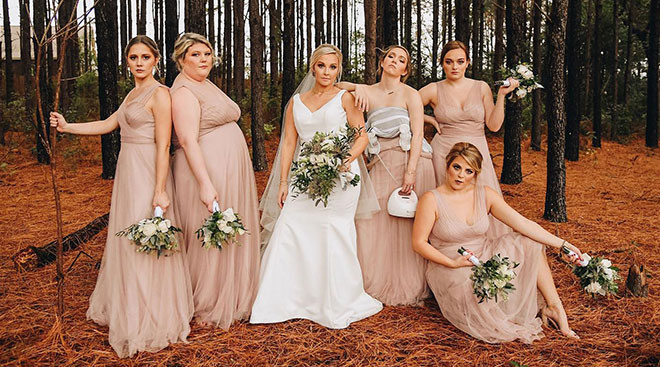 bridesmaid pumping during wedding photos