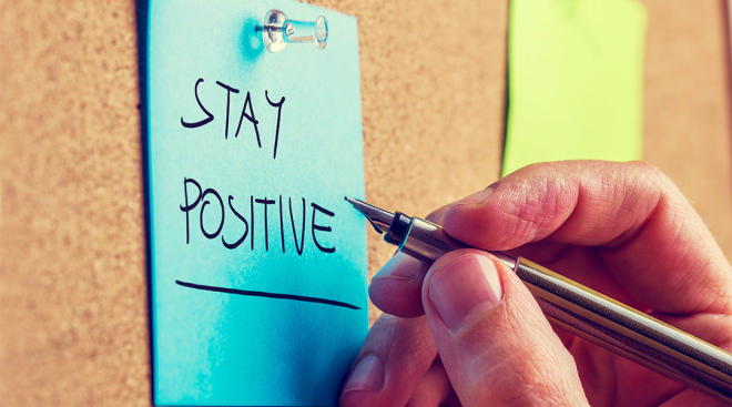 hand writing on sticky note, stay positive