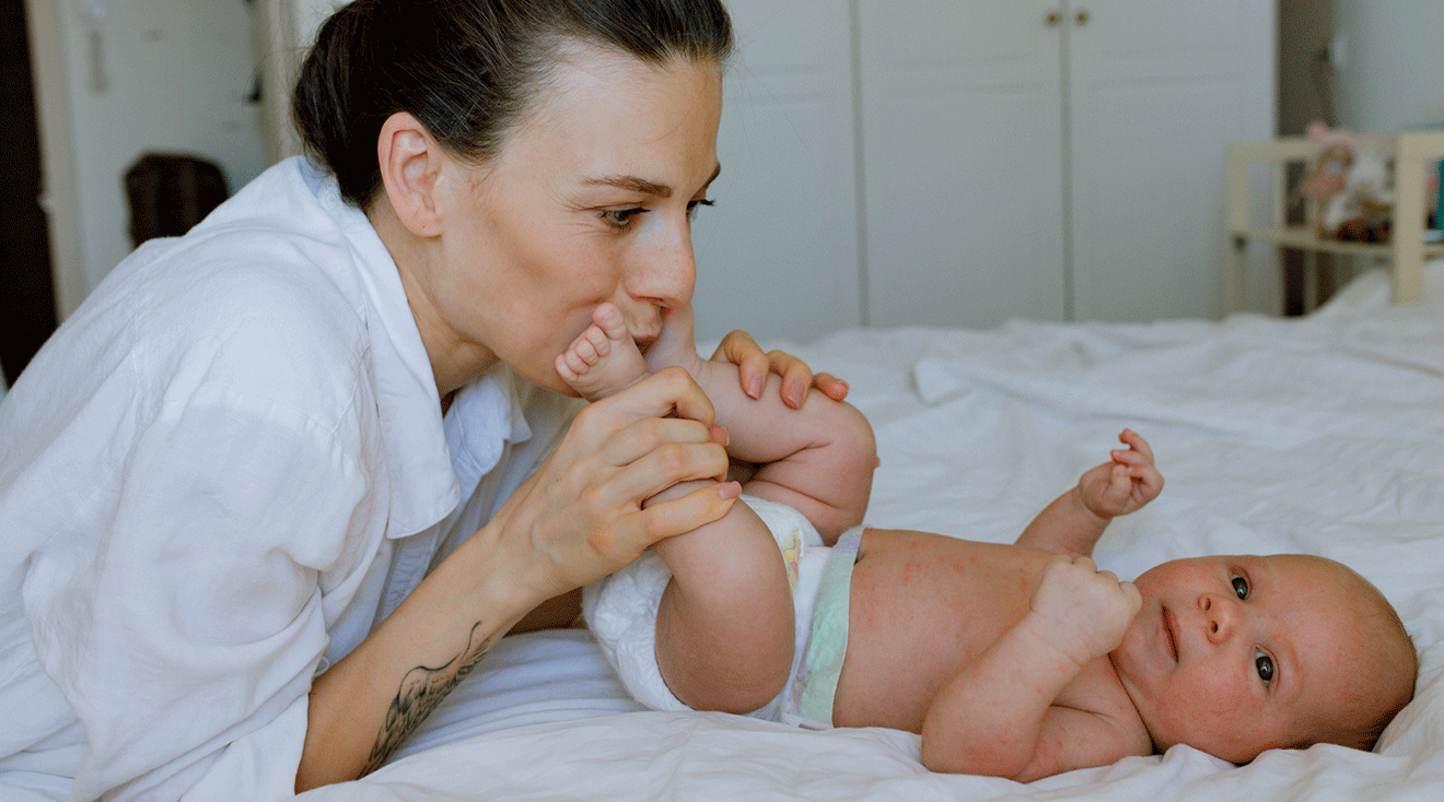 mom kissing baby's feet