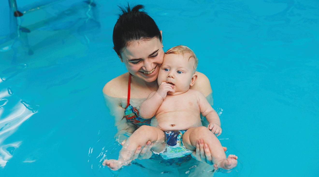 mom and baby in swimming pool