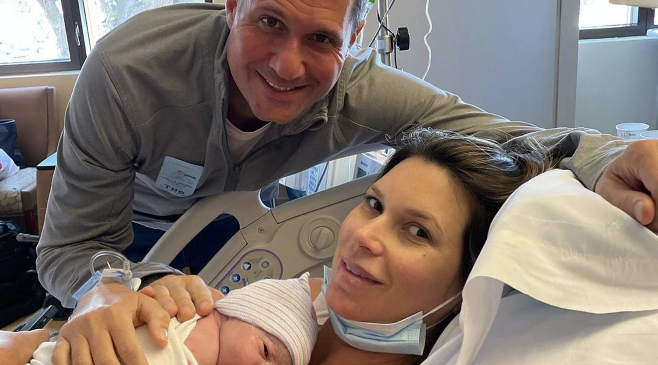maya vander in hospital bed after giving birth to baby girl
