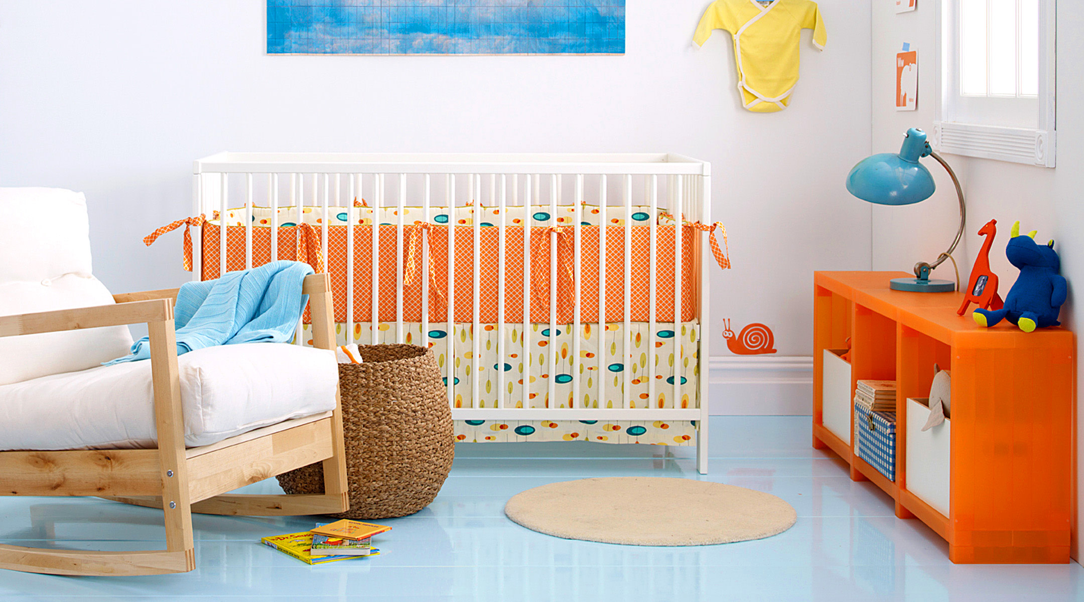 baby nursery with crib that has bumpers
