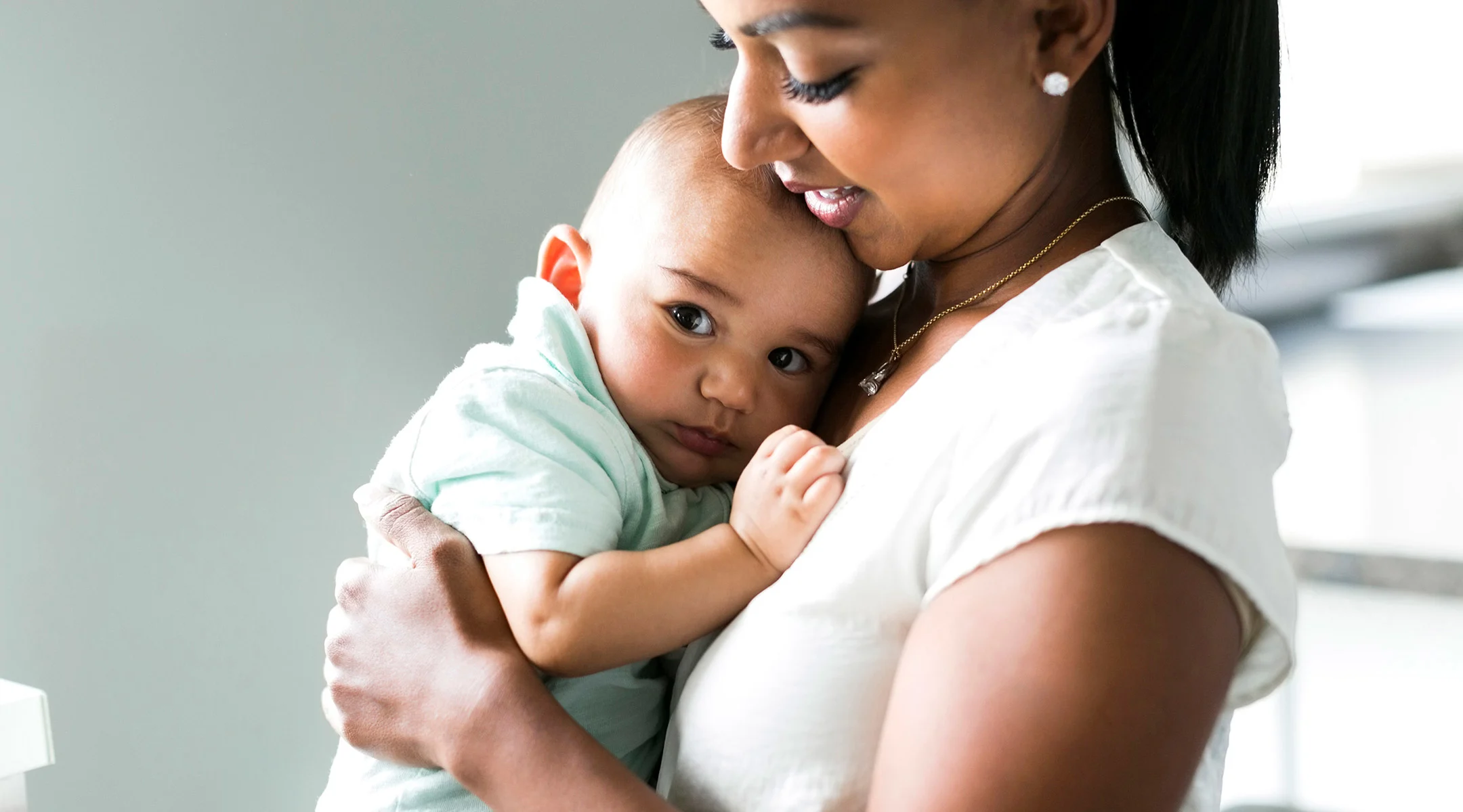 Mom holding sick baby