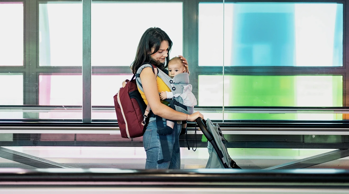 mother traveling with baby in airport