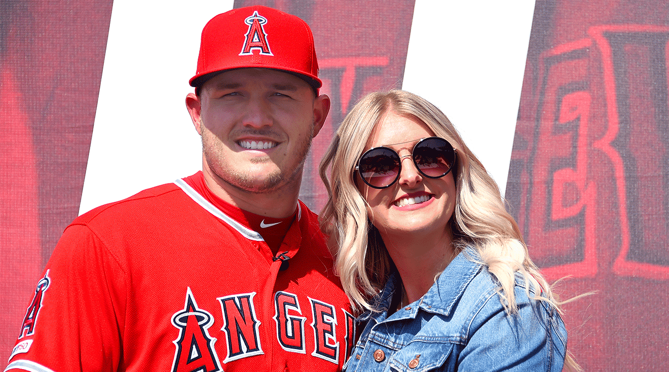 Mike Trout #27 of the Los Angeles Angels of Anaheim poses for a photo with his wife Jessica after press conference, March 2019