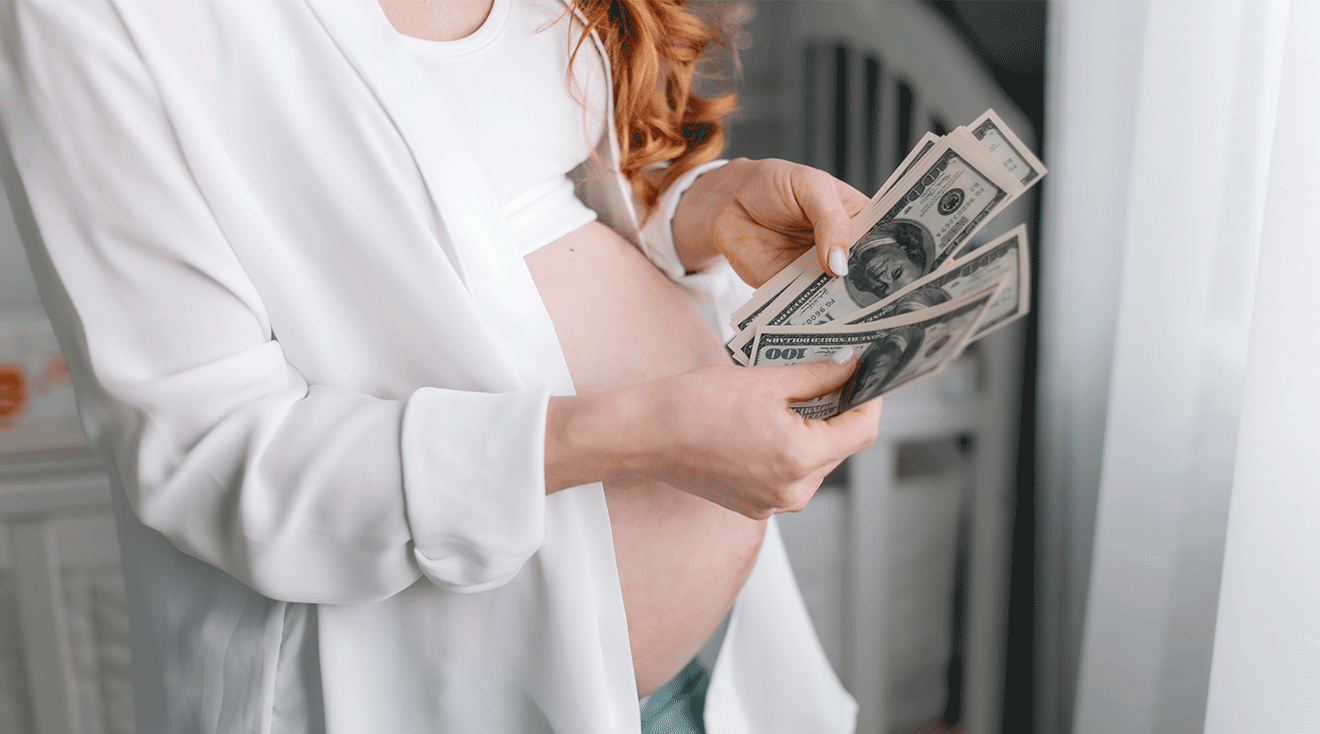 pregnant woman holding cash