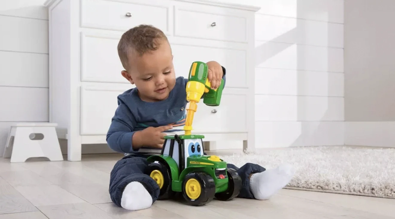 baby playing with a stem toy