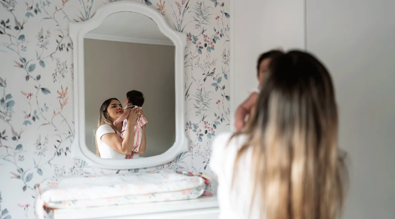 baby lying in crib in room