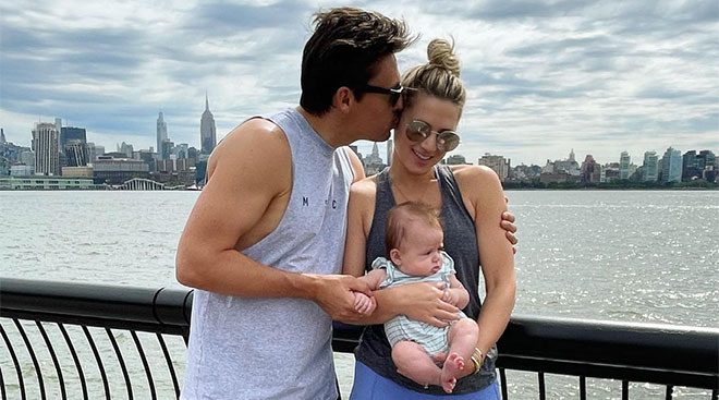 Former bachelor star Lesley Anne Murphey holds her baby with her fiance.
