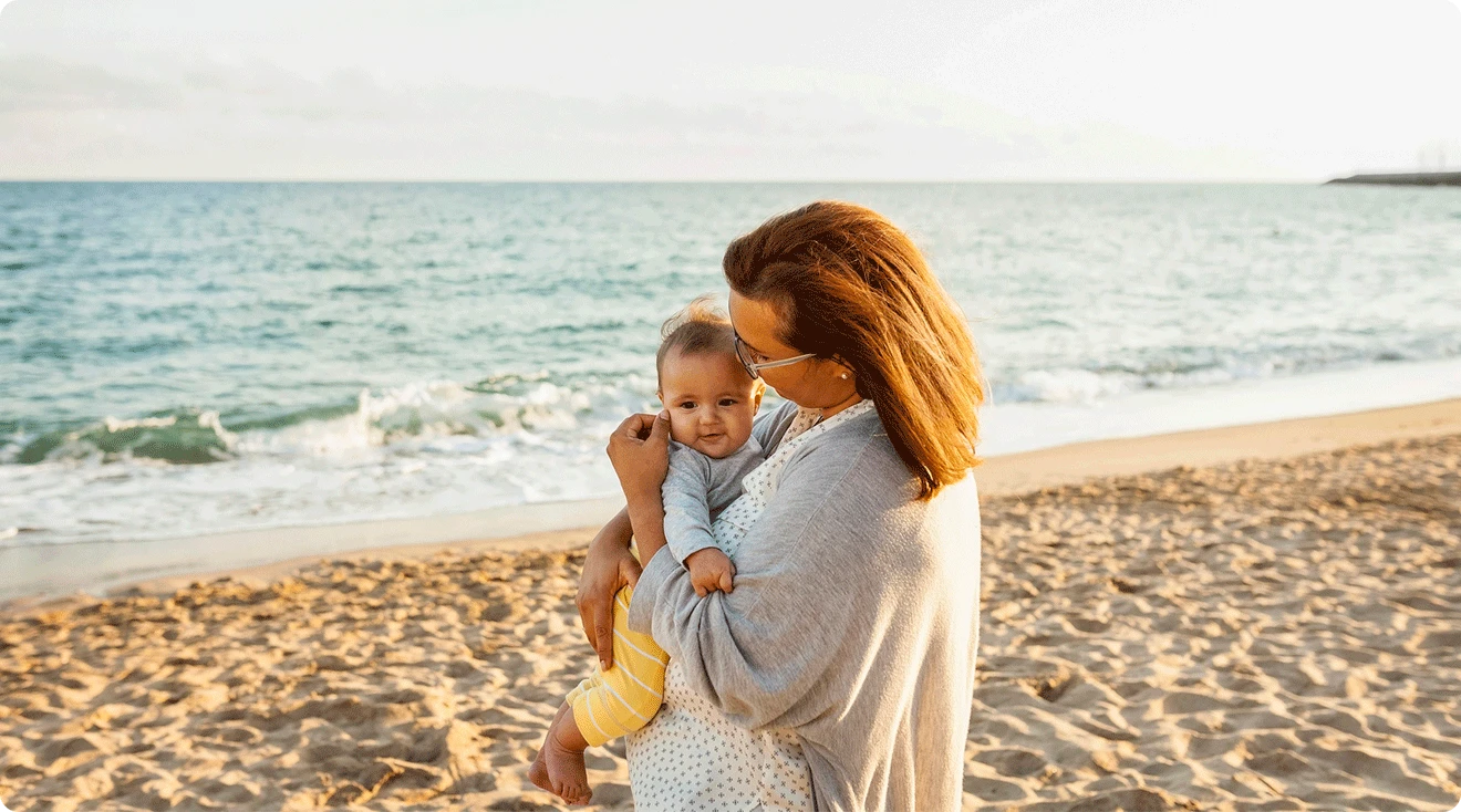 mom and baby at the beach