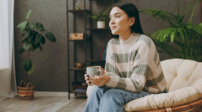 young woman sitting at home