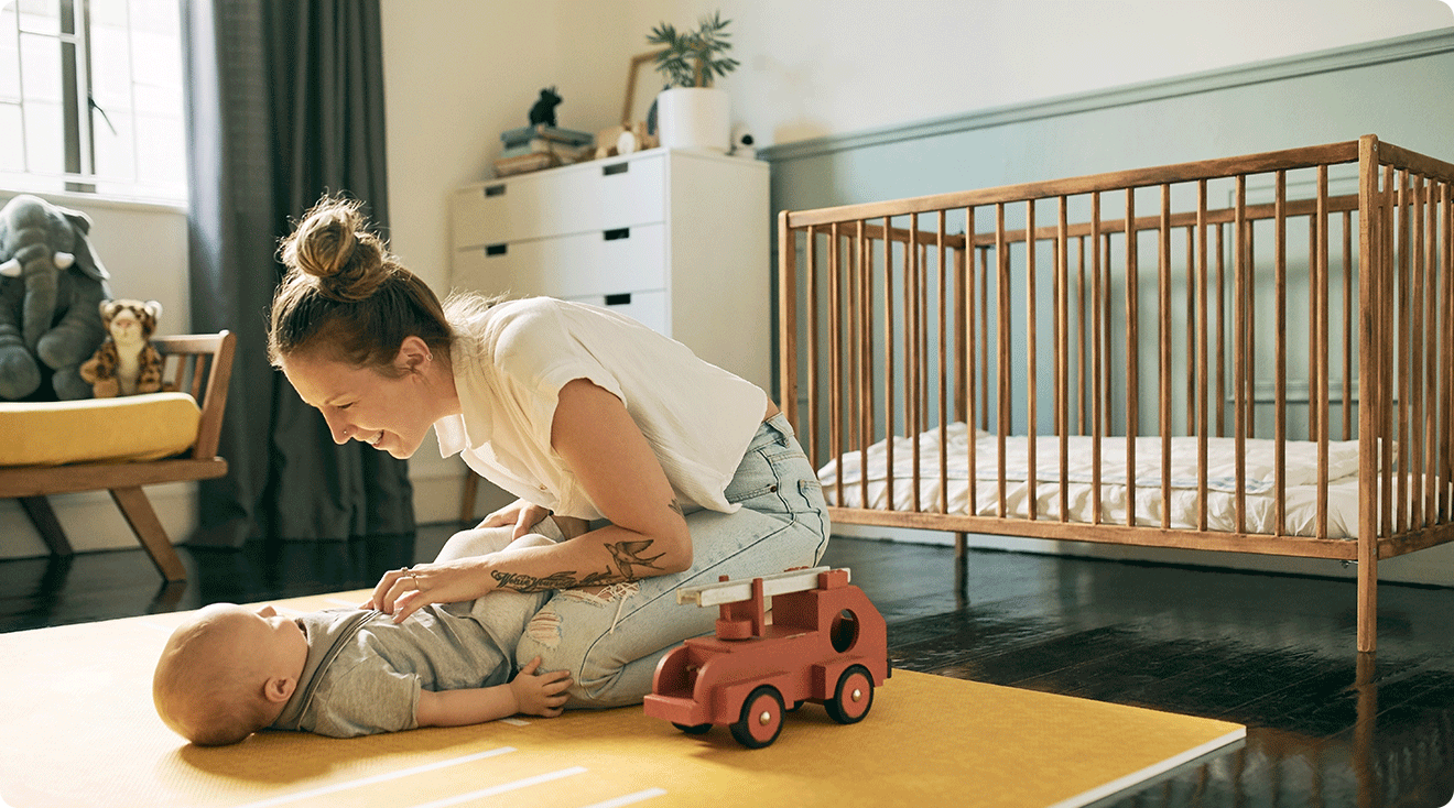 mom and baby in nursery at home