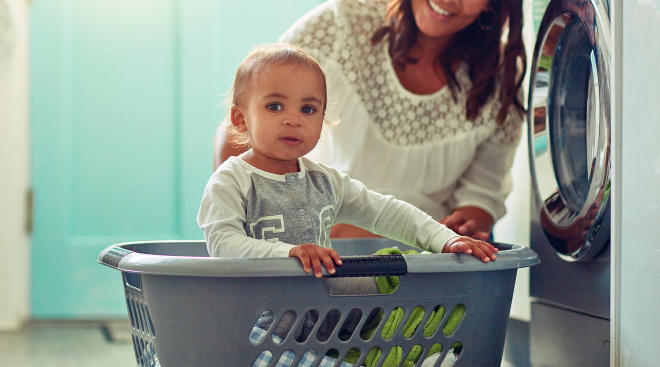 mom doing laundry for baby with sensitive skin