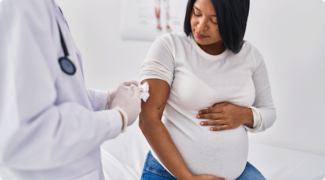 pregnant woman getting a vaccine