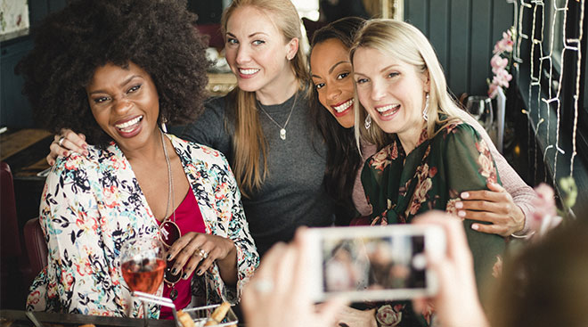 Group of mom friends having fun and hanging out at a restaurant.