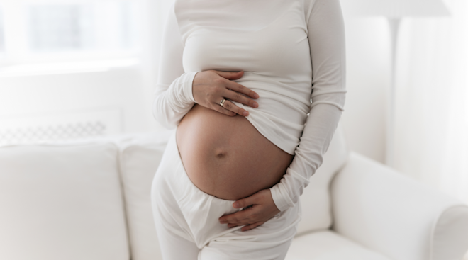 pregnant woman holding belly