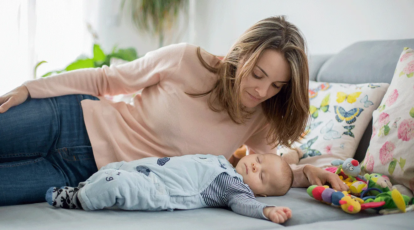 mother looking at newborn baby