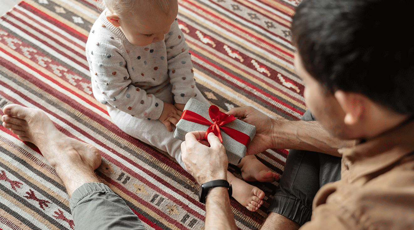 dad opening father's day gift with baby